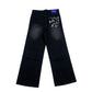 Black jeans with graphic design on a white background